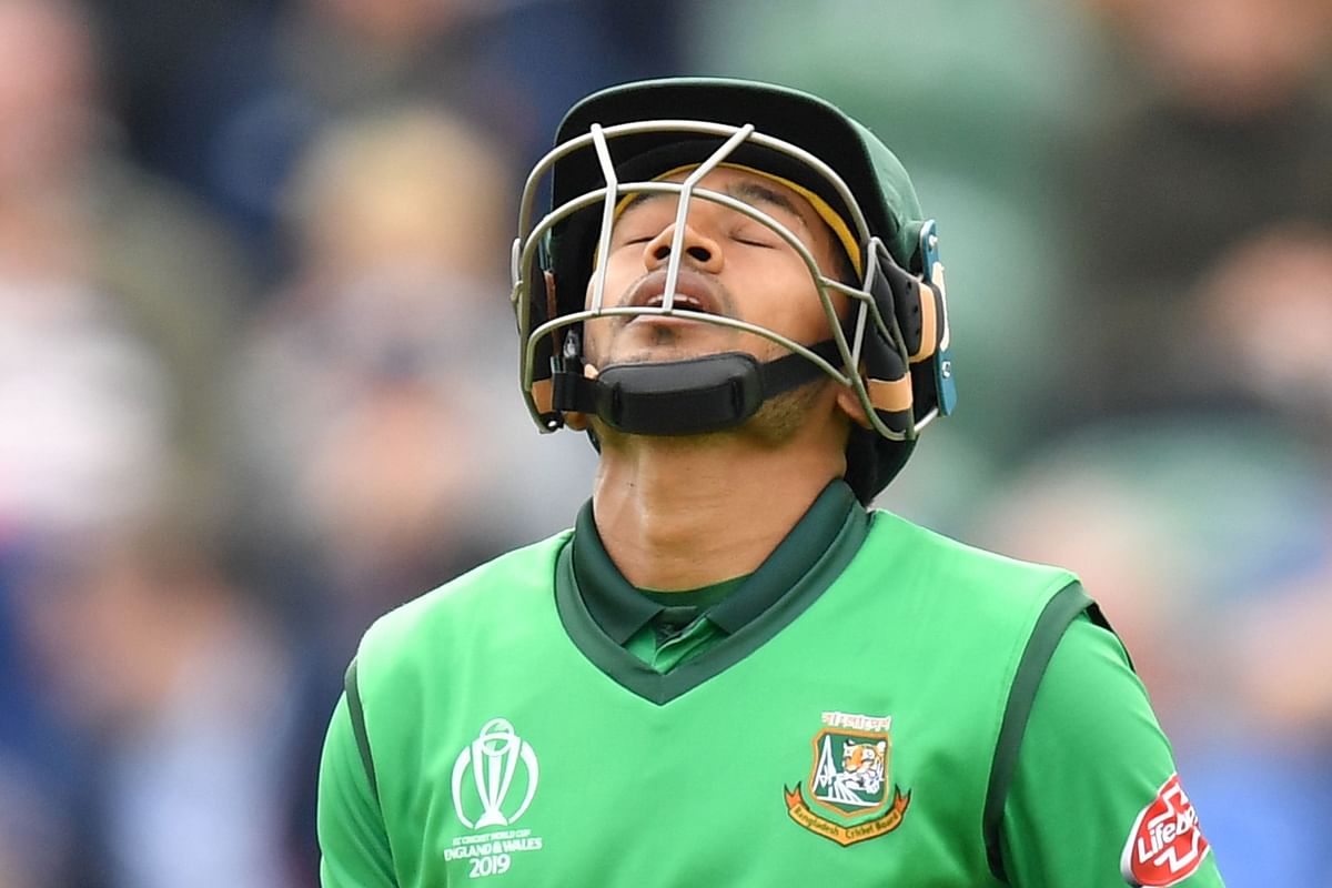 Bangladesh`s Mushfiqur Rahim reacts as he walks back to the pavilion after getting out during the 2019 Cricket World Cup group stage match between West Indies and Bangladesh at The County Ground in Taunton, southwest England, on 17 June 2019.