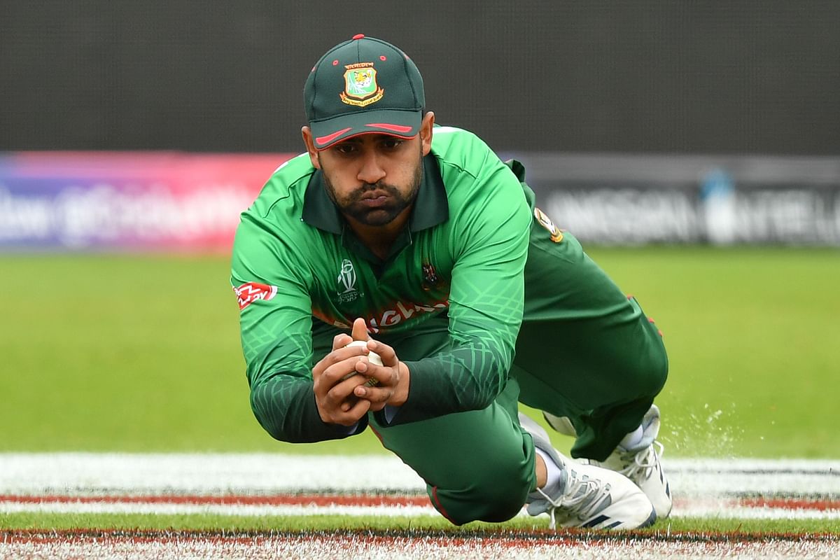 Bangladesh`s Tamim Iqbal takes the catch to dismiss West Indies` Shimron Hetmyer during the 2019 Cricket World Cup group stage match between West Indies and Bangladesh at The County Ground in Taunton, southwest England, on 17 June 2019.