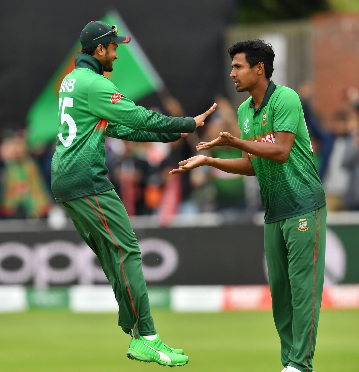 Bangladesh`s Mustafizur Rahman (R) celebrates with Bangladesh`s Shakib Al Hasan after taking the wicket of West Indies` Andre Russell during the 2019 Cricket World Cup group stage match between West Indies and Bangladesh at The County Ground in Taunton, southwest England, on 17 June 2019.