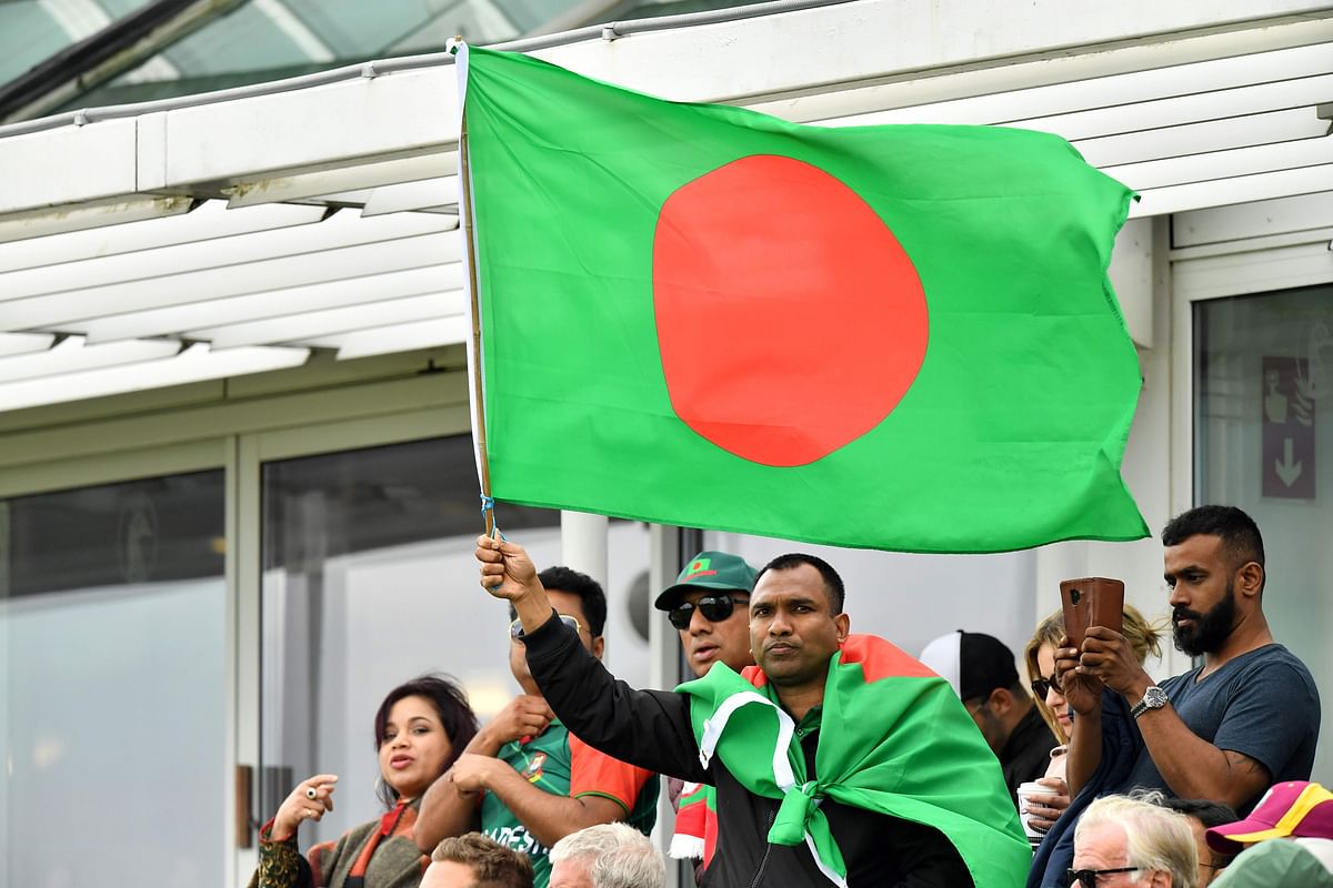 A Bangladesh fan waves a national flag during the 2019 Cricket World Cup group stage match between West Indies and Bangladesh at The County Ground in Taunton, southwest England, on 17 June 2019.