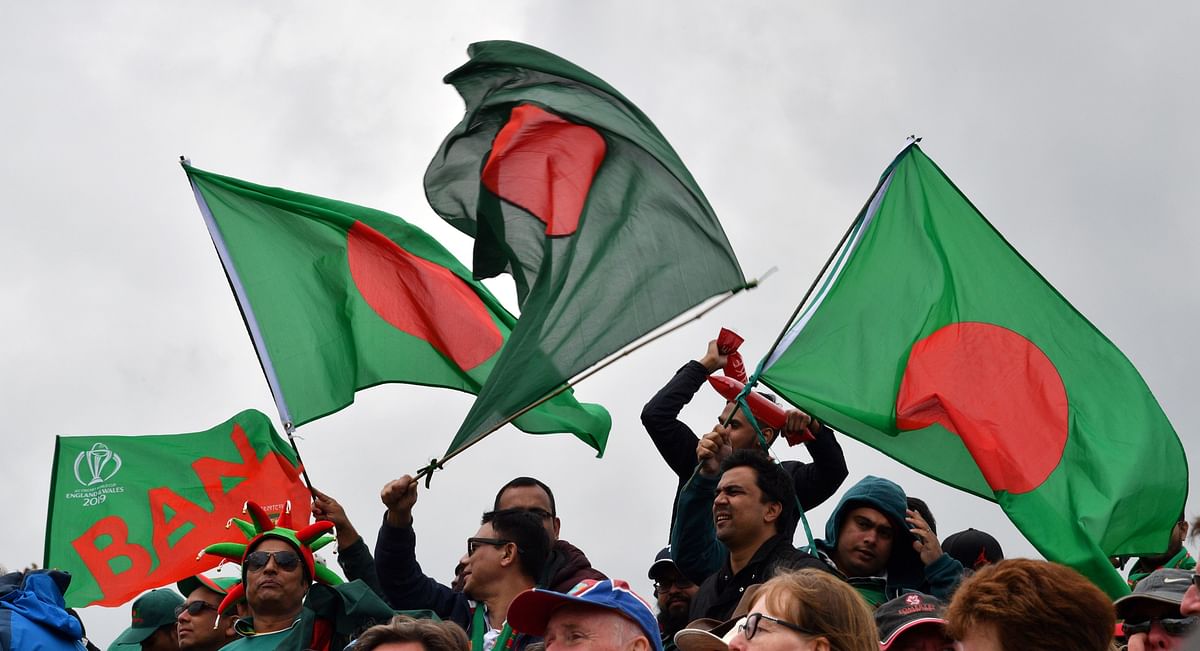 Bangladesh supporters wave their country`s national flag during the 2019 Cricket World Cup group stage match between West Indies and Bangladesh at The County Ground in Taunton, southwest England, on 17 June 2019.
