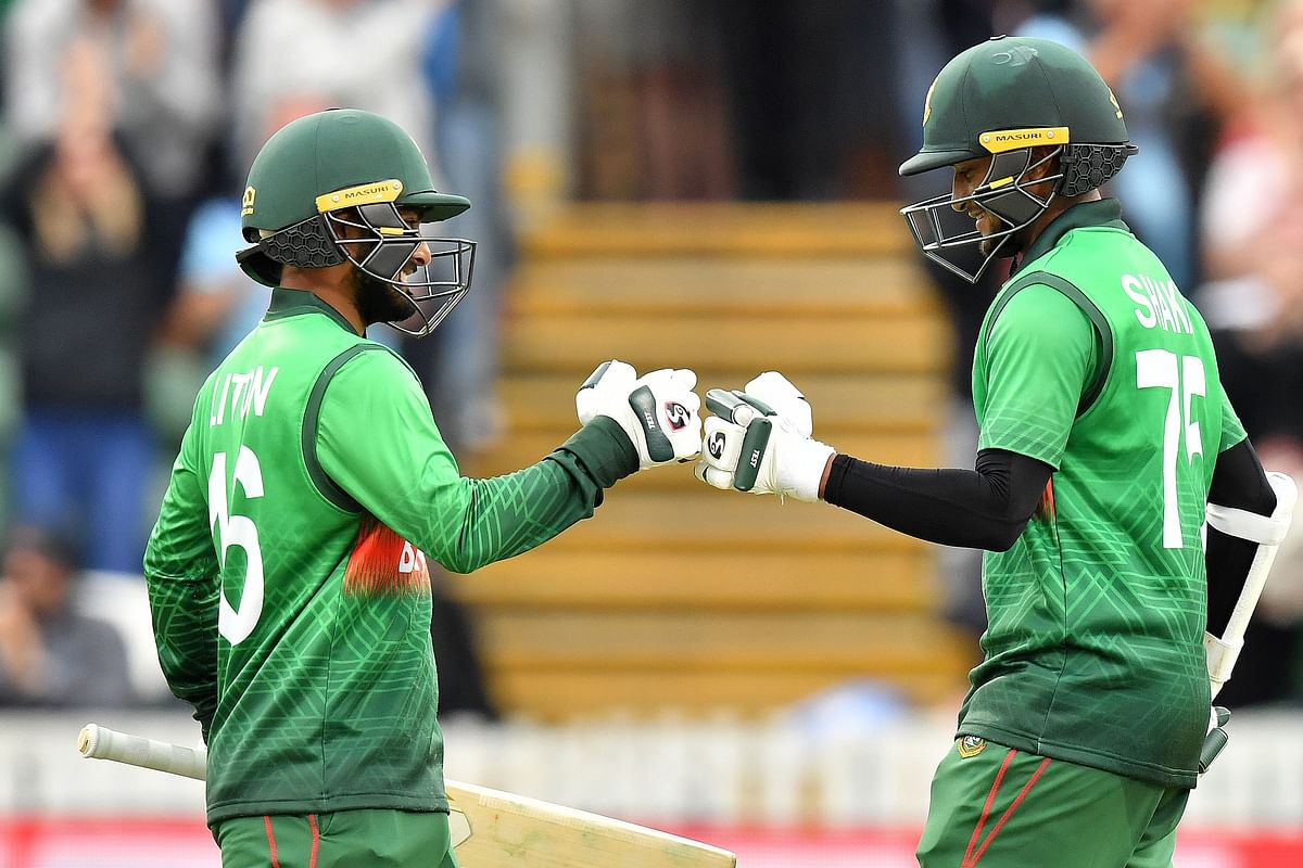 Bangladesh`s Shakib Al Hasan (R) celebrates his century with Bangladesh`s Liton Das during the 2019 Cricket World Cup group stage match between West Indies and Bangladesh at The County Ground in Taunton, southwest England, on 17 June 2019.