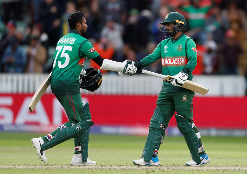 Bangladesh`s Shakib Al Hasan and Liton Das celebrate winning the match. Photo: AFP
