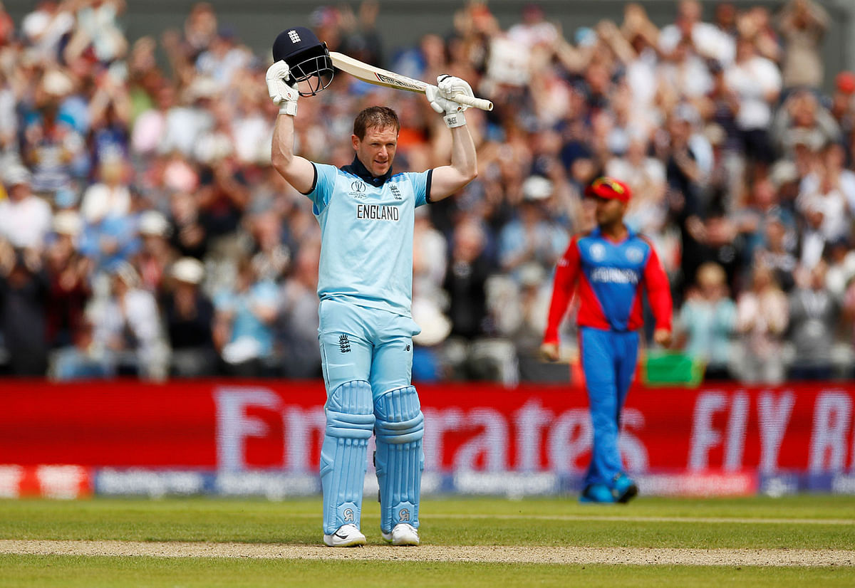 England`s captain Eoin Morgan celebrates his century during the 2019 Cricket World Cup group stage match against Afghanistan at Old Trafford in Manchester, England, on 18 June 2019. Photo: Reuters