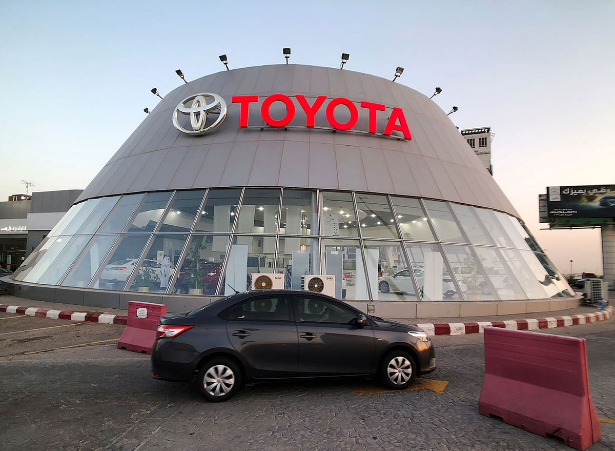 A car passes in front of Toyota dealer in Dhahran, Saudi Arabia. Photo: Reuters
