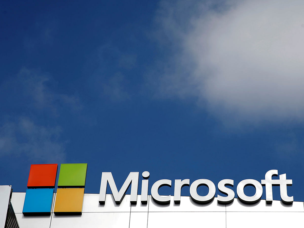 A Microsoft logo is seen next to a cloud in Los Angeles. Photo: AFP