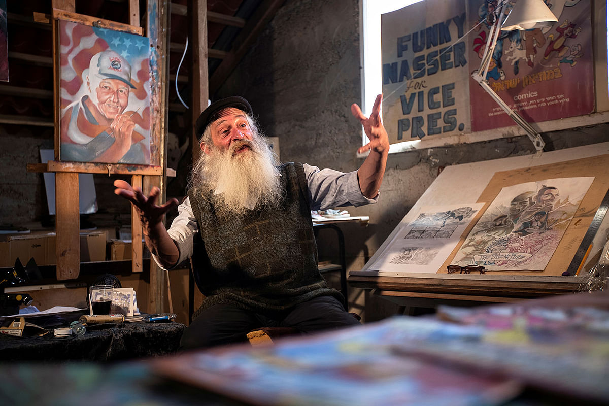 Michael Netzer, an American comics artist formerly named Mike Nasser, gestures during his interview with Reuters at his attic studio in his home in the Jewish settlement of Ofra in the Israeli-occupied West Bank on 28 May. Photo: Reuters