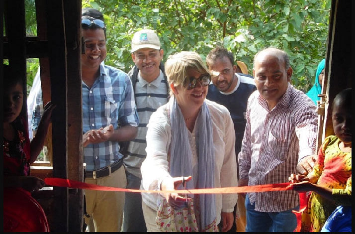 Gaynor cuts the ribbon for a new pre-school in Bangladesh. Cap: Daventry Express