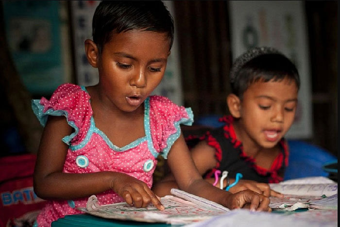 Children studying in a Bangladeshi pre-school built by the Best Years. Cap: Daventry Express