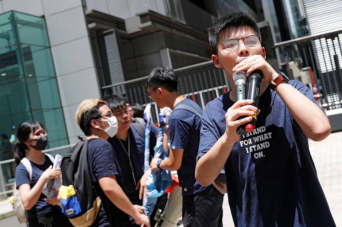 Pro-democracy activist Joshua Wong speaks as people protest outside police headquarters, demanding Hong Kong’s leaders to step down and withdraw the extradition bill, in Hong Kong, China on 21 June 2019. Photo: Reuters
