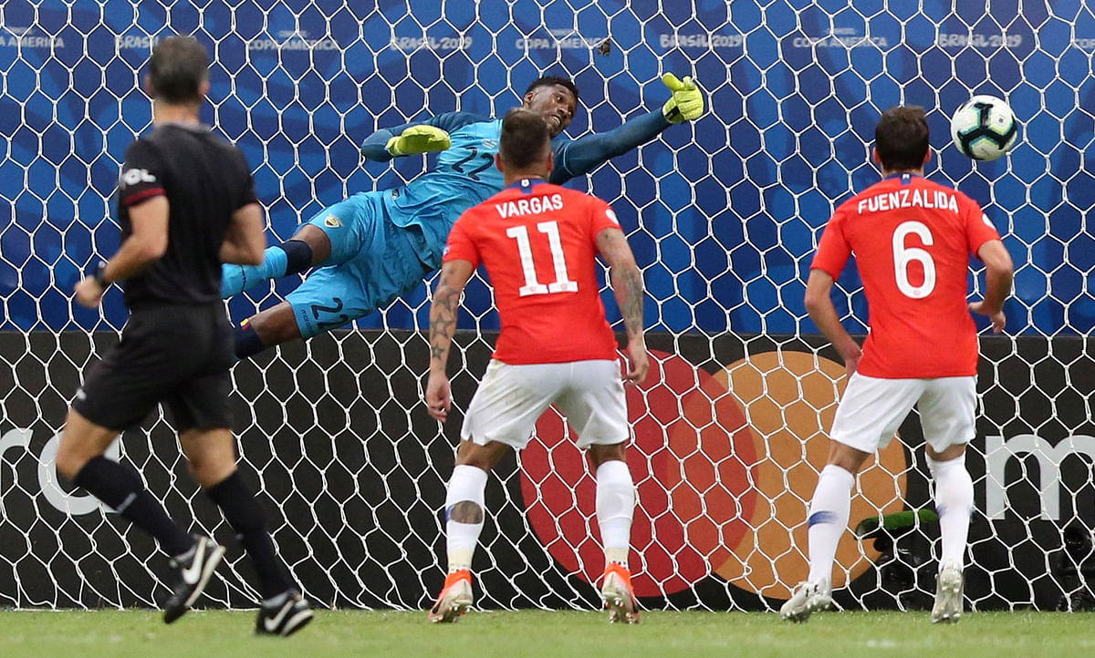 Chile`s Alexis Sanchez scores their second goal as Ecuador`s Alexander Dominguez attempts to save it in the Copa America Group C match between Ecuador and Chile at Arena Fonte Nova, Salvador, Brazil on 21 June 2019. Photo: Reuters