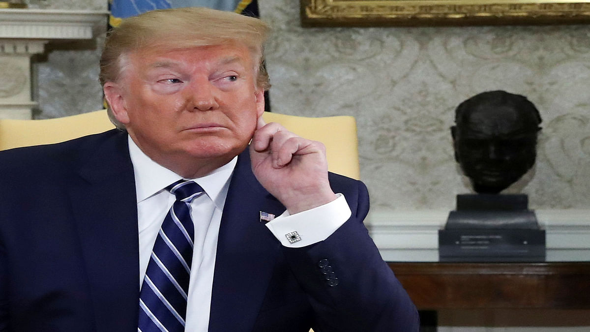 US president Donald Trump listens to questions from reporters during a meeting with Canada`s prime minister Justin Trudeau in the Oval Office of the White House in Washington, US on 20 June. Photo: Reuters