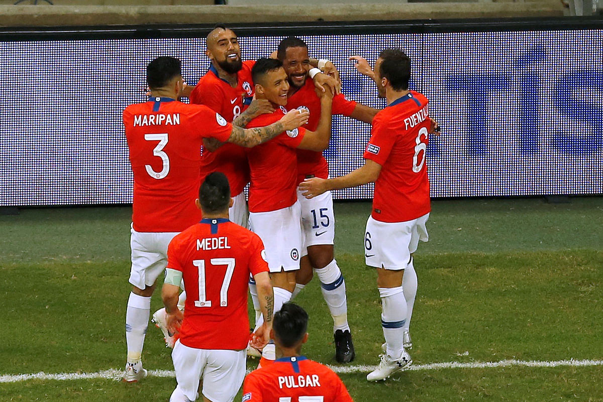 Chile`s Alexis Sanchez celebrates scoring their second goal with team mates in the Copa America Group C match against Ecuador at Arena Fonte Nova, Salvador, Brazil on 21 June 2019. Photo: Reuters