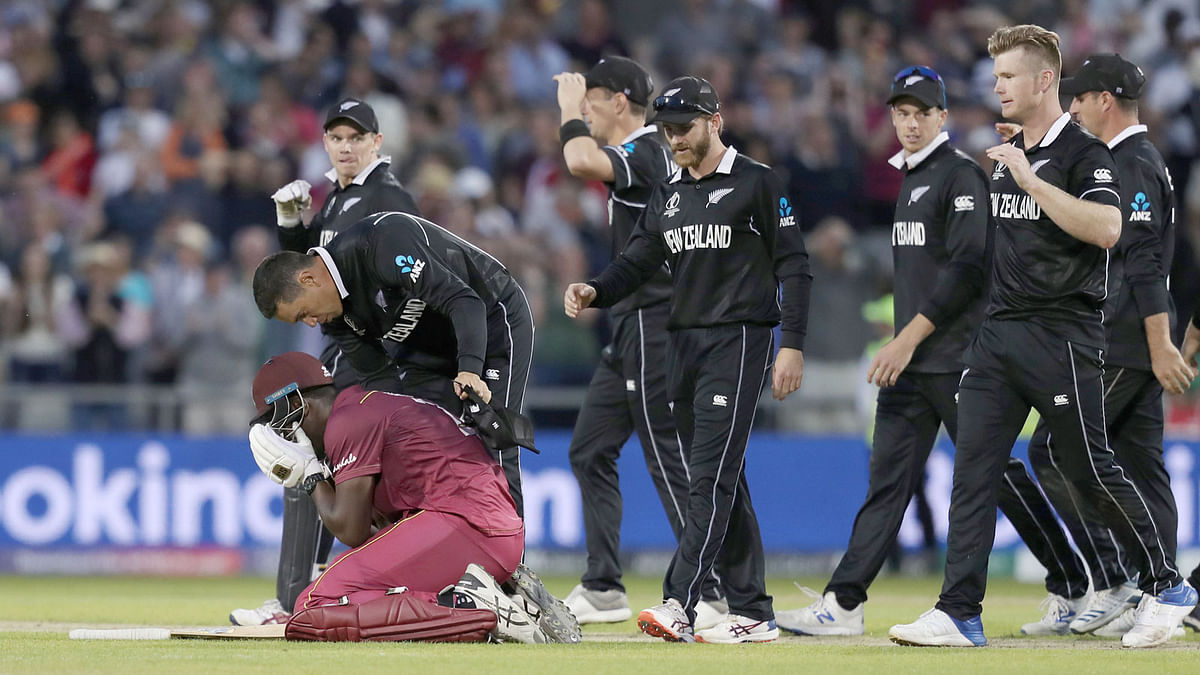 West Indies` Carlos Brathwaite looks dejected after losing his wicket and the match against West Indies on 22 June, 2019. Photo: Reuters