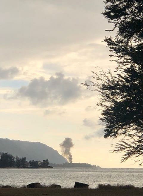 A plume of smoke rises after an airplane crash, seen from Kaiaka Bay Beach Park, in Haleiwa, Hawaii, US, 21 June 2019 in this image obtained from social media. Photo: Reuters