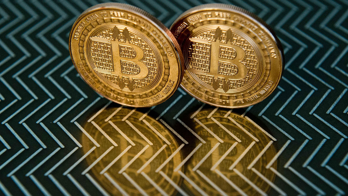 In this file photo taken on 17 June 2014 in Washington, DC shows bitcoin medals. Bitcoin surged to a near 16-month high above $11,000 24 June 2019, overshadowing stock, foreign exchange and commodity markets and breathing new life into a sector that many had declared moribund.