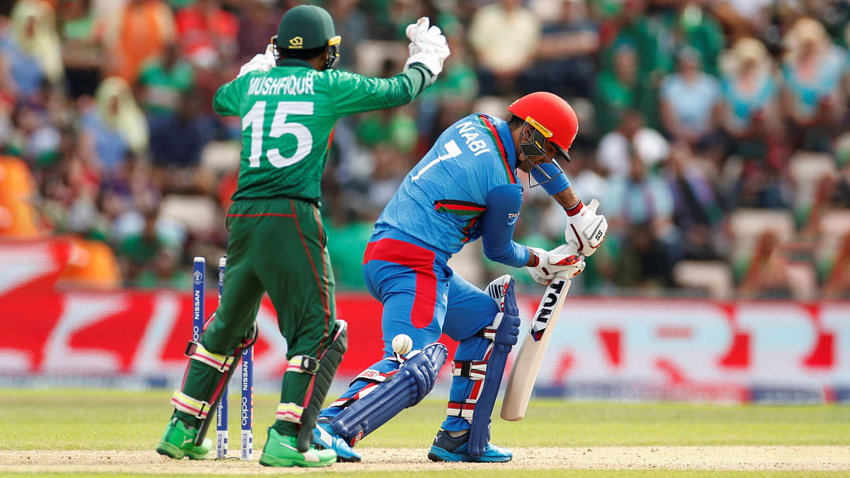 Afghanistan`s Mohammad Nabi is bowled by Bangladesh`s Shakib Al Hasan on 24 June 2019. Photo: Reuters