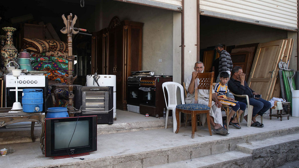 A picture taken on 13 June, shows a second-hand store where displaced Syrians (unseen) sell their belongings on the outskirts of the Syrian town of Abyan in the rebel-held western Aleppo province. Photo: AFP