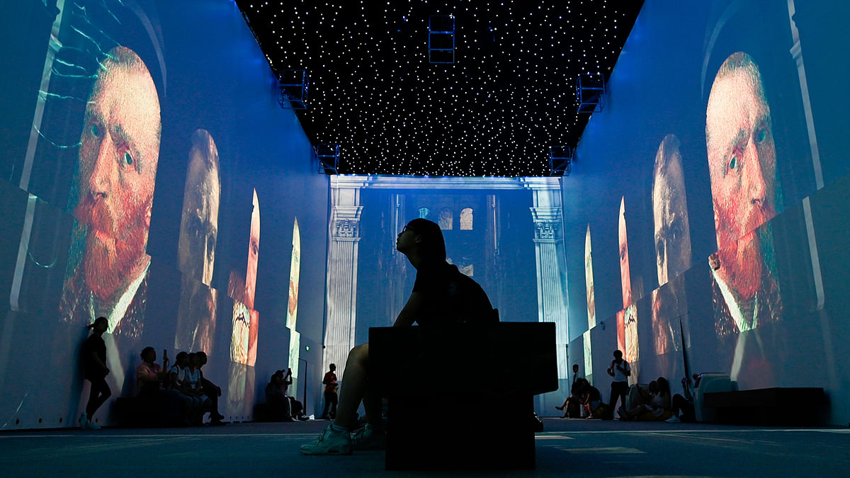 People visit an immersive exhibition about Vincent van Gogh in Beijing on 25 June 2019.Photo: AFP