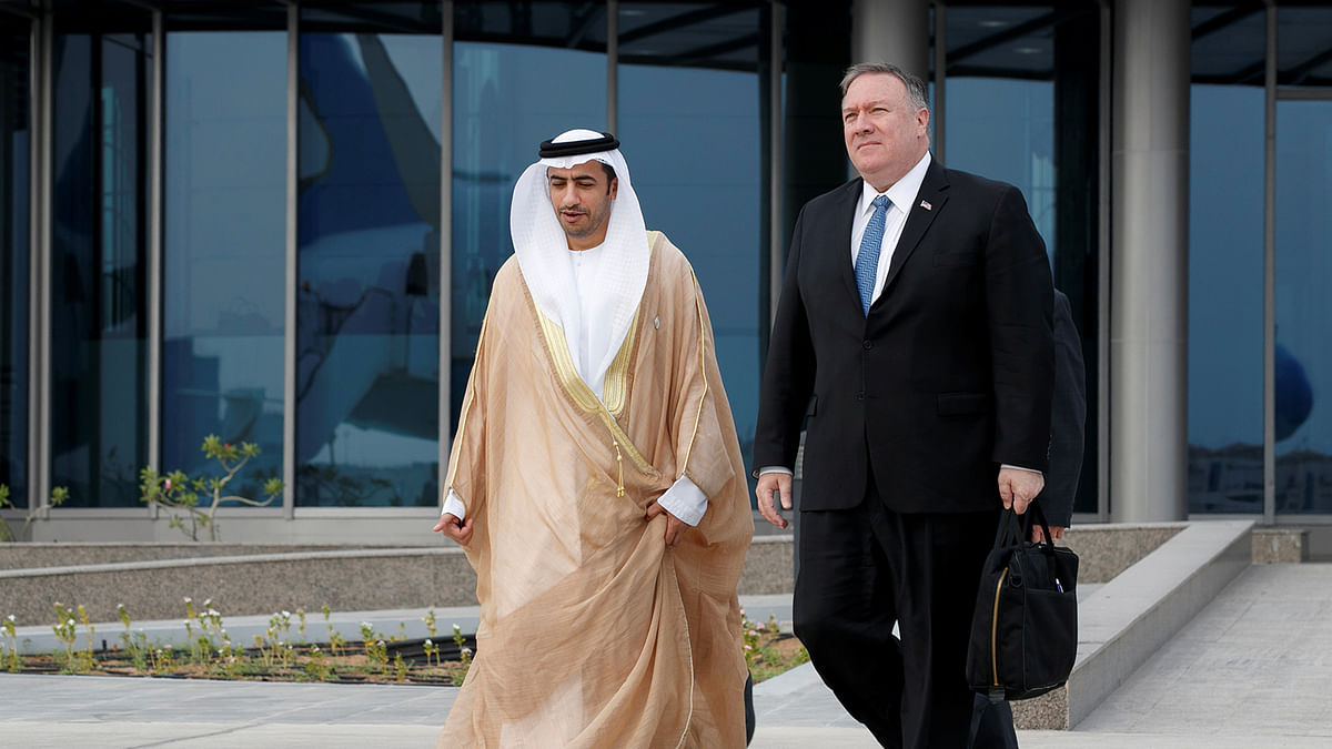 Secretary of State Mike Pompeo, right, walk with Shihad Al Faheem, Assistant Foreign Ministry Undersecretary for Protocol Affairs, to his plane as Pompeo departs Abu Dhabi. Photo: Reuters
