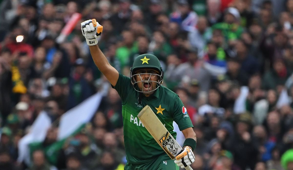 Pakistan`s Babar Azam celebrates after scoring a century (100 runs) during the 2019 Cricket World Cup group stage match between New Zealand and Pakistan at Edgbaston in Birmingham, central England, on 26 June 2019. Photo: AFP
