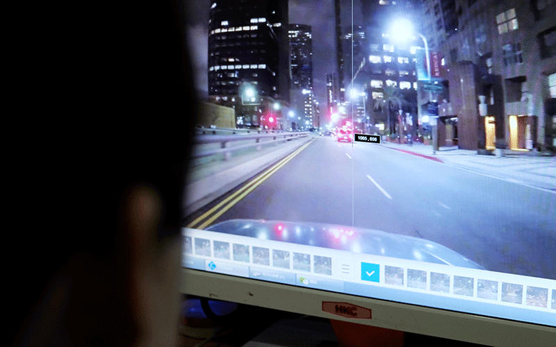 Jia Yahui, a 29-year-old employee labels vehicles on an image on a computer screen, which would serve for developing artificial intelligence (AI) and machine learning technology, at the Qian Ji Data Co in Jia county, Henan. Photo: Reuters