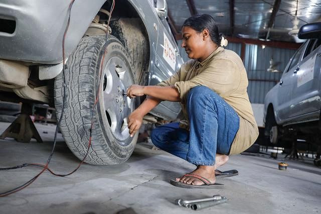 Female car mechanic working at her workplace in capital`s Panthapath recently. Photo: Sabina Yesmin