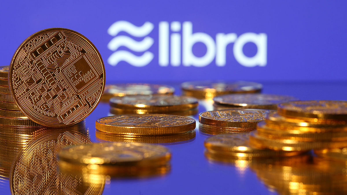 Representations of virtual currency are displayed in front of the Libra logo in this illustration picture on 21 June. Photo: Reuters