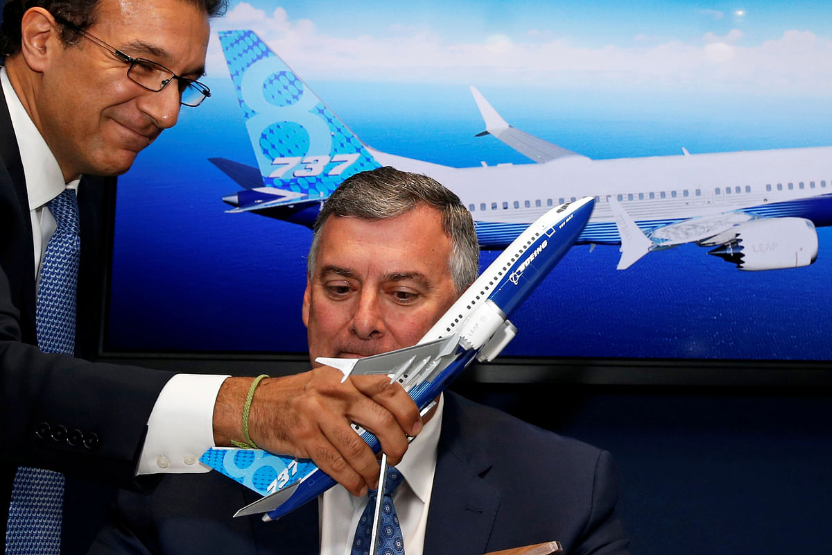 Boeing Commercial Airplanes vice President Ihssane Mounir holds a model of a Boeing 737 MAX in front of Kevin McAllister, Boeing Commercial Airplanes CEO, during a commercial announcement at the 53rd International Paris Air Show at Le Bourget Airport near Paris, France on 18 June. Photo: Reuters