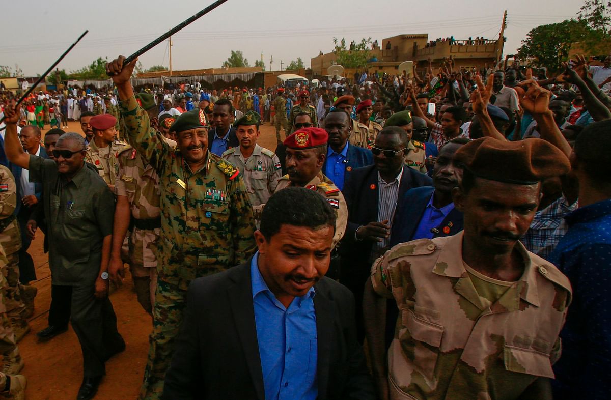 General Abdel Fattah al-Burhan, the head of Sudan`s ruling military council, greets his supporters in Khartoum`s twin city of Omdurman on 29 June. Photo: AFP