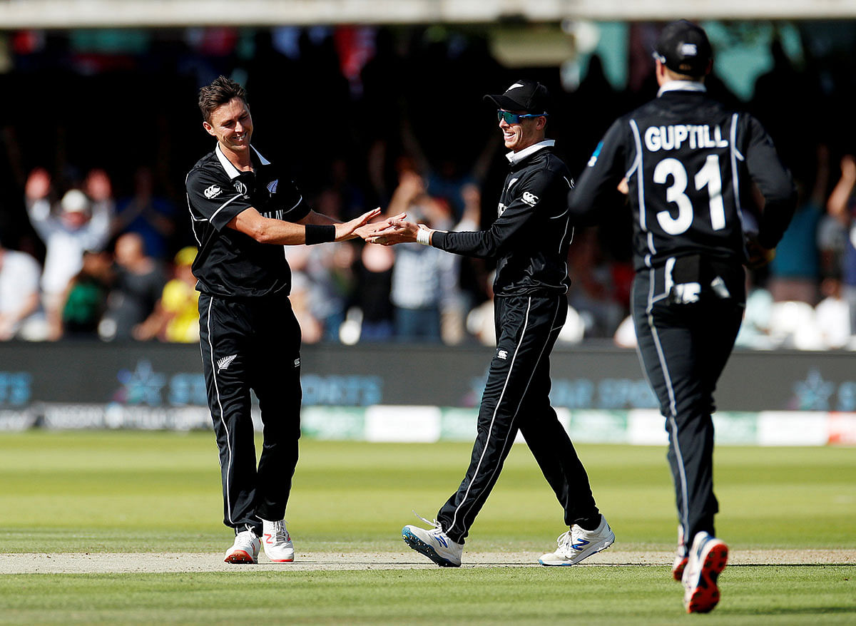 New Zealand`s Trent Boult celebrates taking the wicket of Australia`s Jason Behrendorff to complete a hat-trick in the ICC Cricket World Cup match against Australia at Lord`s, London, Britain on 29 June 2019. Photo: Reuters