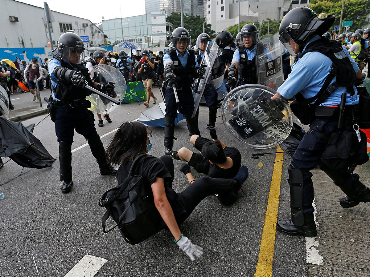 Riot police try to disperse protesters near a flag raising ceremony for the anniversary of Hong Kong handover to China in Hong Kong, China on 1 July. Photo: Reuters