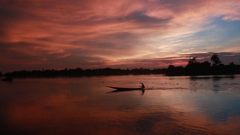 A boatman rowing in Chengerkhal river in Sylhet on 30 June, 2019. Photo: Anis Mahmud