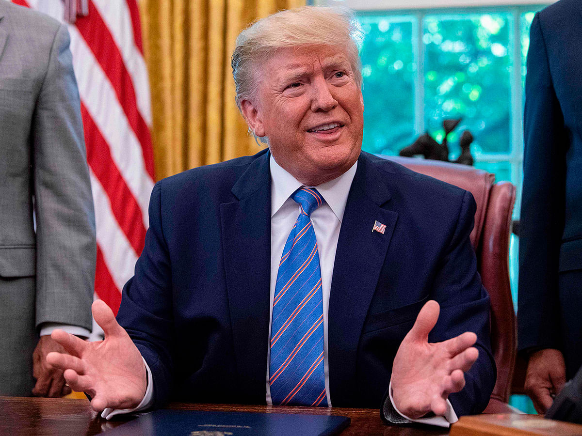 US president Donald Trump speaks to the press after signing a bill for border funding legislation in the Oval Office at the White House in Washington, DC, on 1 July. Photo: AFP