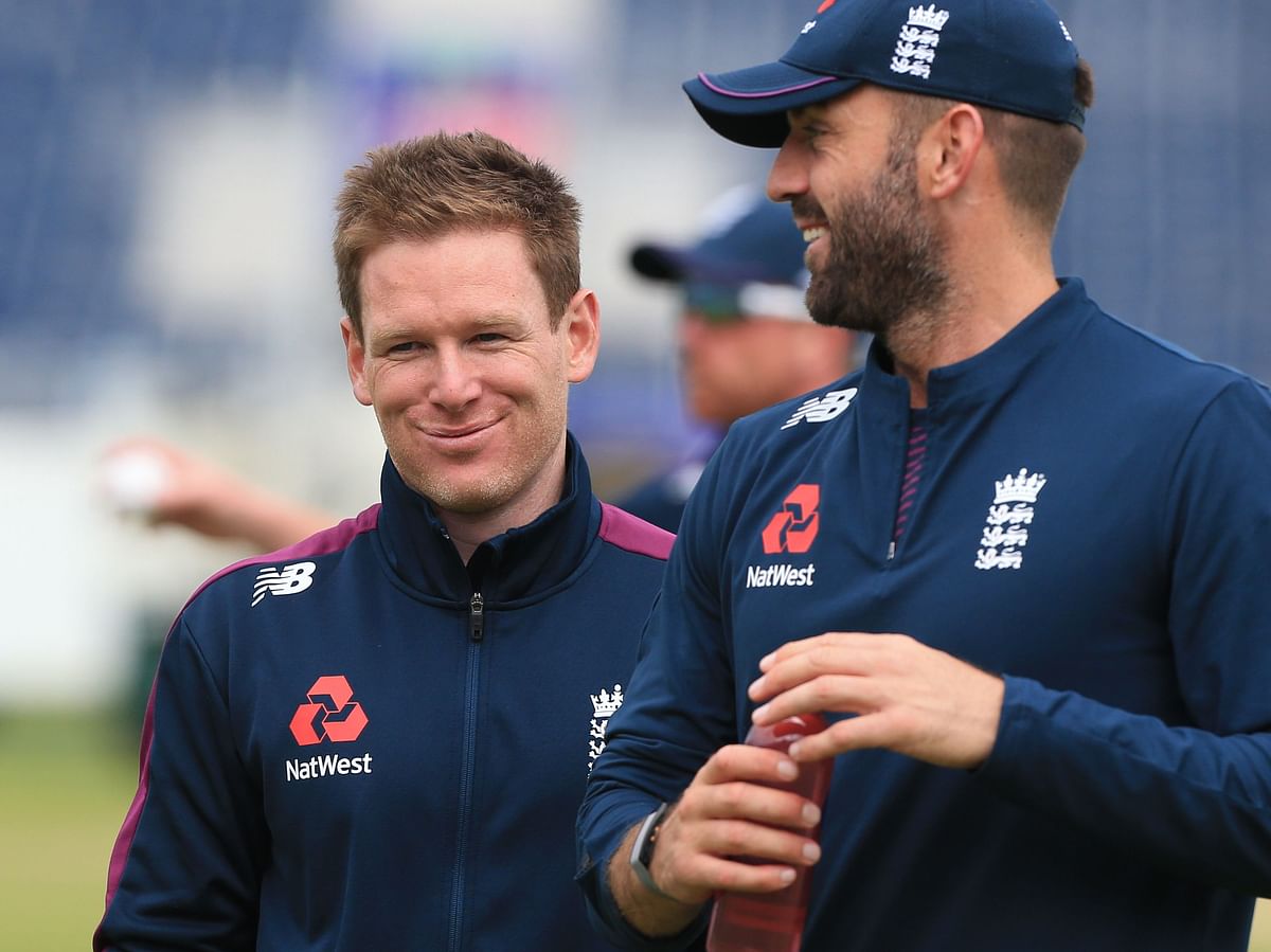 England`s captain Eoin Morgan (L) laughs with teammate Liam Plunkett during a training session at the Riverside Ground, in Chester-le-Street, northeast England, on 2 July 2019, ahead of their 2019 Cricket World Cup group stage match against New Zealand. Photo: AFP
