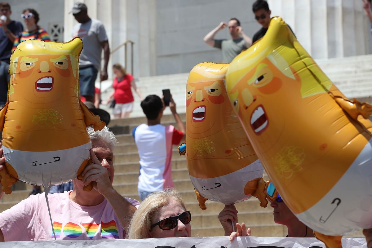 Members of the activist group Code Pink hold Baby Trump balloons during a news conference at the Lincoln Memorial to protest against president Trump and the tanks that were brought in for the Salute to America ceremony on the Fourth of July, on 3 July 2019 in Washington, DC. Photo: AFP