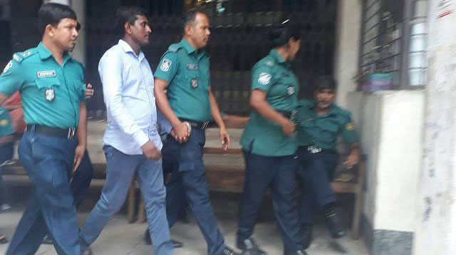 Police taking suspended deputy inspector general (DIG) of police Mizanur Rahman`s nephew sub-inspector Mahmudul Hasan to jail on Thursday. Photo: Asaduzzaman