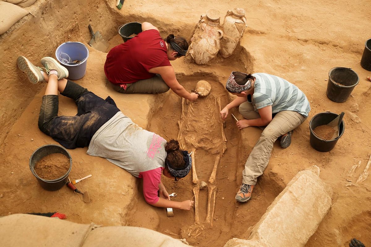 n this file photo taken on 28 June 2016, a team of foreign archaeologists extract skeletons at the excavation site of the first Philistine cemetery ever found in the Mediterranean coastal Israeli city of Ashkelon. Photo: AFP