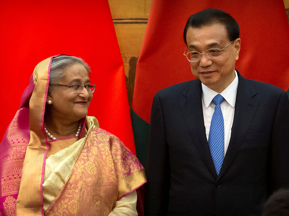 Bangladesh`s prime minister Sheikh Hasina and China`s Premier Li Keqiang talk during a signing ceremony at the Great Hall of the People in Beijing, China on 4 July 2019. Photo: Reuters