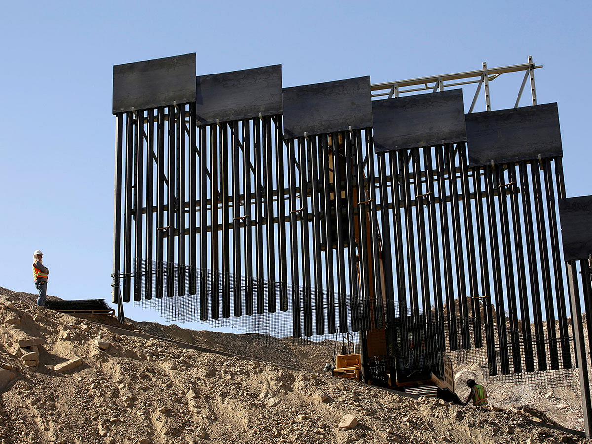 A construction crew works on a bollard-type private border wall, crowd-funded by We Build The Wall group at Sunland Park, New Mexico, as pictured from Ciudad Juarez, Mexico on 30 May 2019. Reuters File Photo