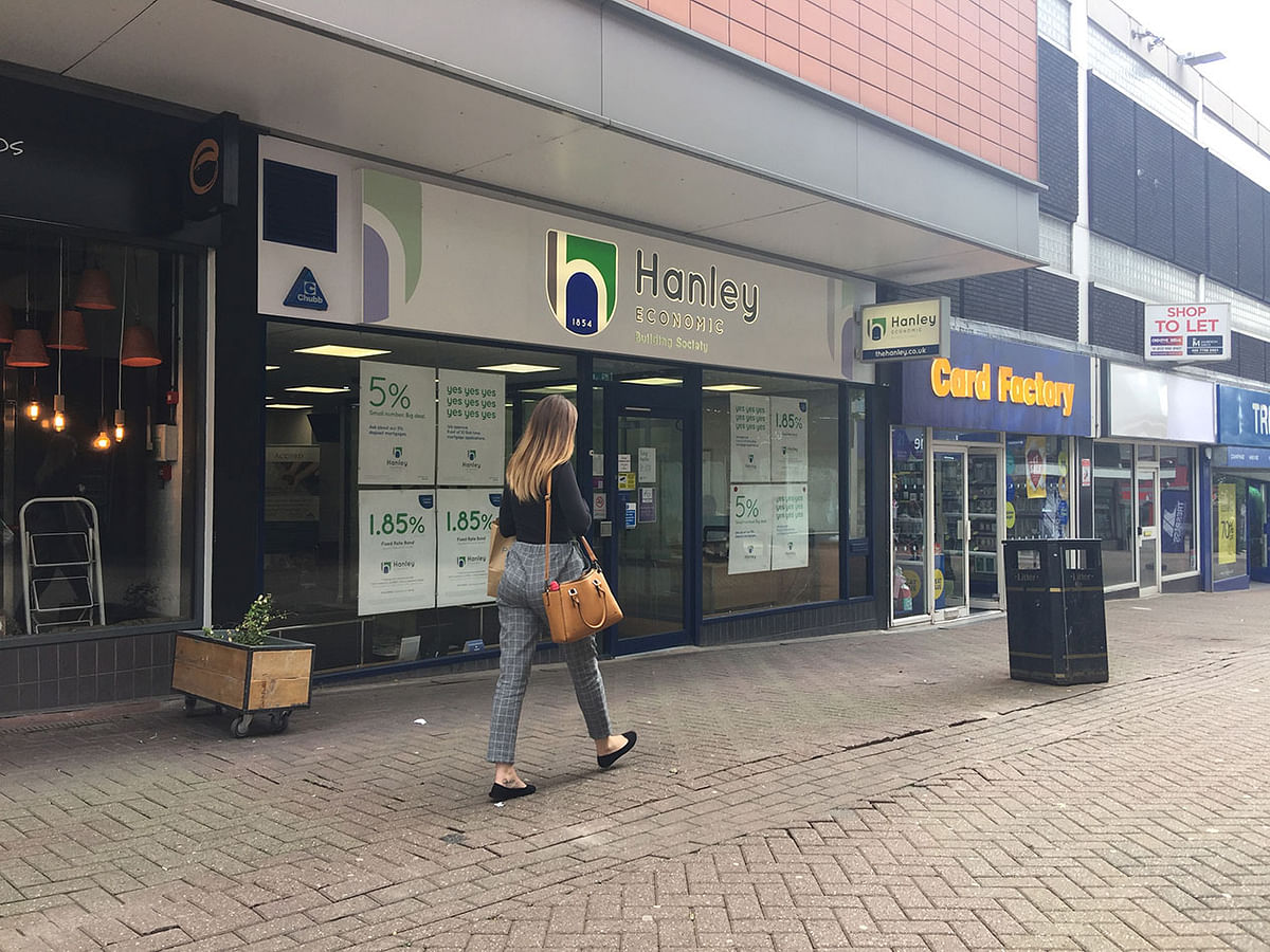 A woman passes by the Hanley Economic Building Society branch in Stoke-on-Trent, Britain 18 June 2019. Photo: Reuters