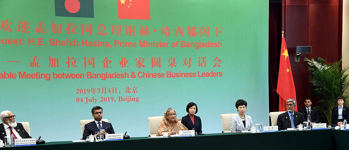 Prime minister Sheikh Hasina (3rd L) holds a roundtable with the business leaders of Bangladesh and China in Beijing on 4 July. Photo: PID