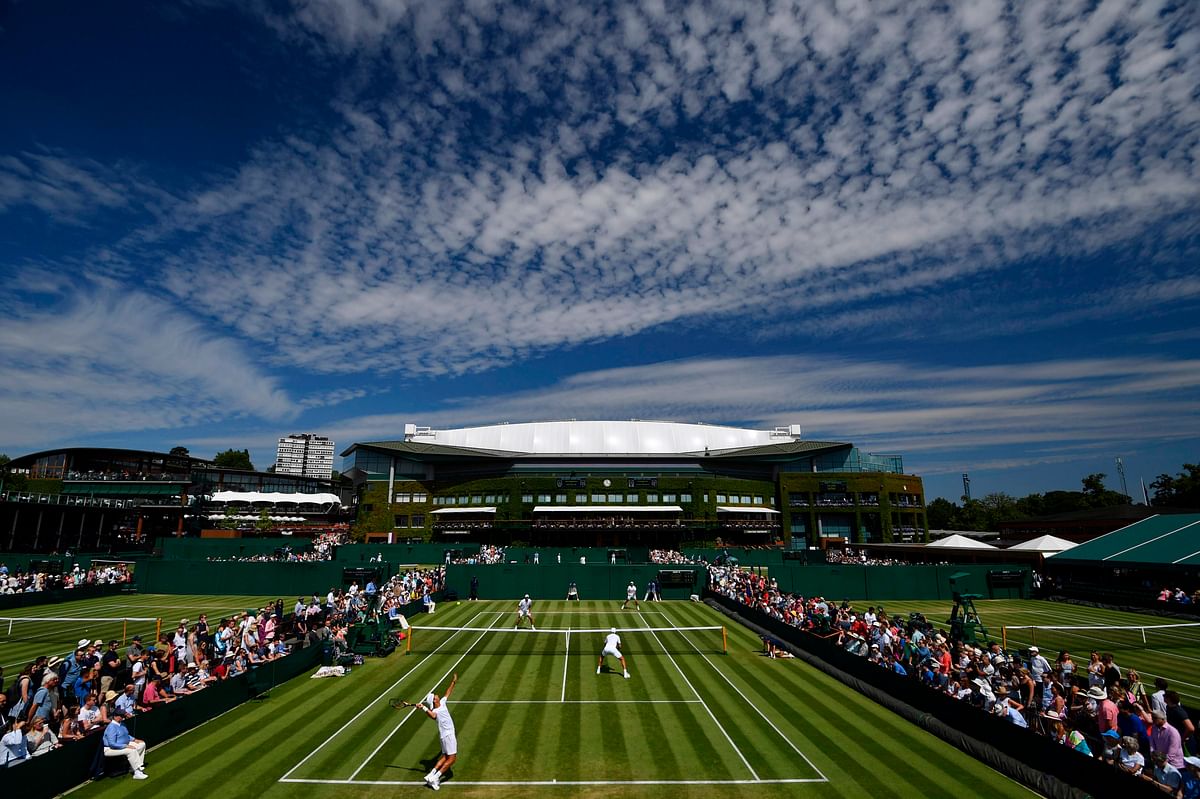 Netherlands`s Jean-Julien Rojer and Romania`s Horia Tecau play against France`s Fabrice Martin and Monaco`s Hugo Nys during their men`s doubles second round match on the fifth day of the 2019 Wimbledon Championships at The All England Lawn Tennis Club in Wimbledon, southwest London, on 5 July 2019. Photo: AFP