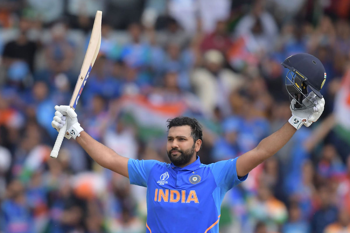 India`s Rohit Sharma celebrates after reaching his century during the 2019 Cricket World Cup group stage match between Sri Lanka and India at Headingley in Leeds, northern England, on 6 July 2019. AFP : AFP
