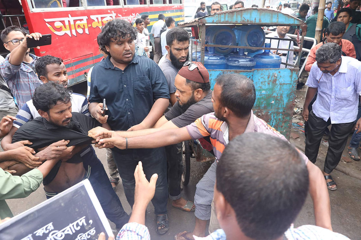 Protesters in a scuffle during protests against the recent gas price hike. Paltan, Dhaka on 7 July 2019. Photo: Saiful Islam