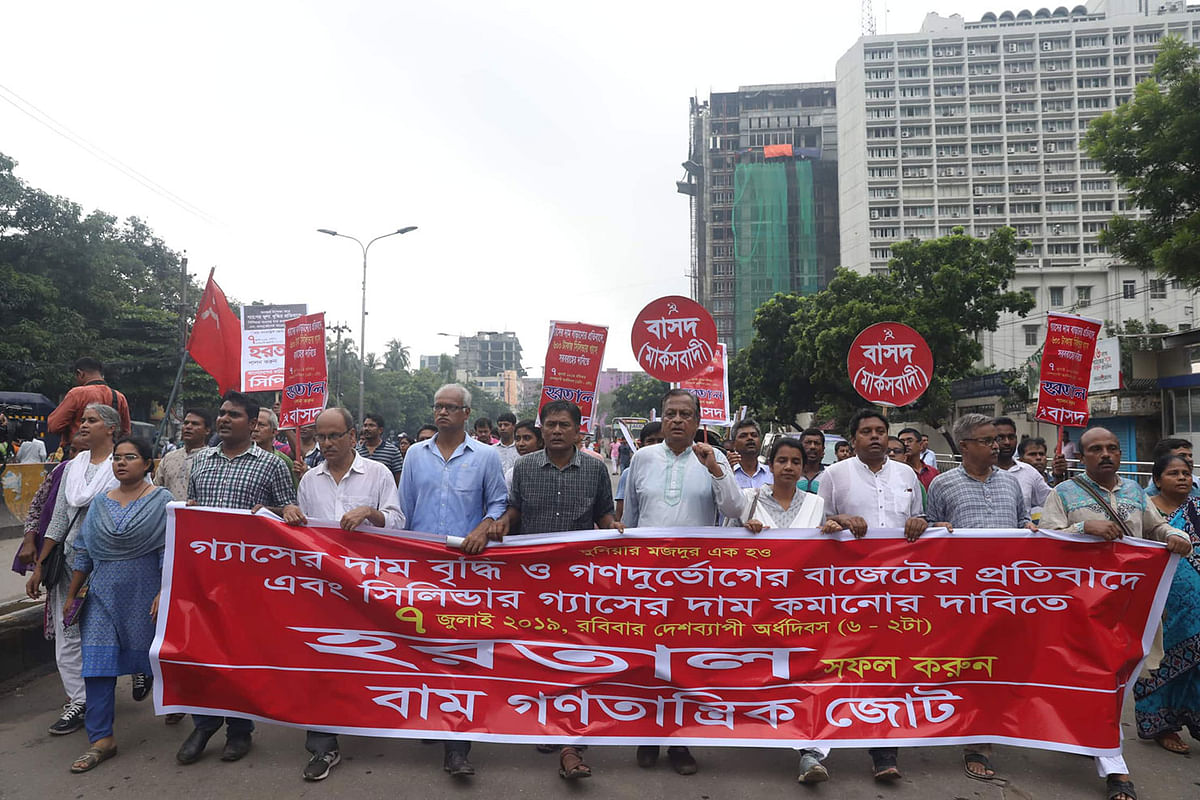 People bring out a procession protesting against the recent hike of gas prices in Paltan, Dhaka on 7 July 2019. On 30 June, the government raised the gas price by 32.8 per cent on average with effect from 1 July. Photo: Saiful Islam