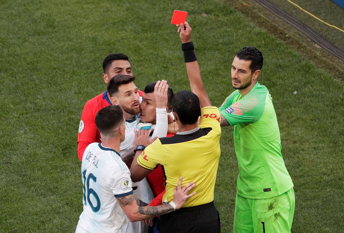 Chile`s Gary Medel and Argentina`s Lionel Messi are shown a red card by referee Mario Diaz de Vivar in the Copa America Brazil 2019 Third Place Play Off match at Arena Corinthians, Sao Paulo, Brazil on 6 July 2019. Photo: Reuters