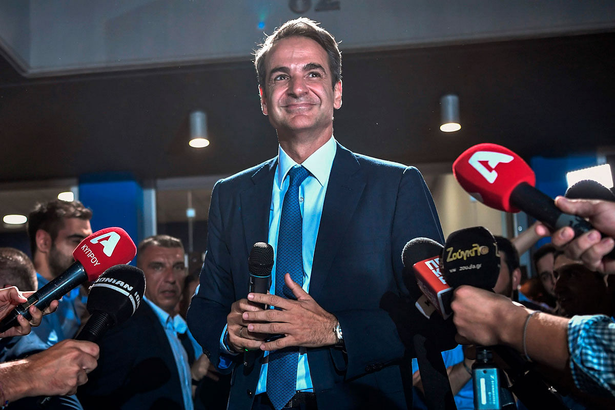 Greece`s newly elected prime minister and leader of conservative New Democracy party Kyriakos Mitsotakis, speaks to the press outside the party`s headquarters after the official results of the elections, in Athens on 7 July 2019. Photo: AFP