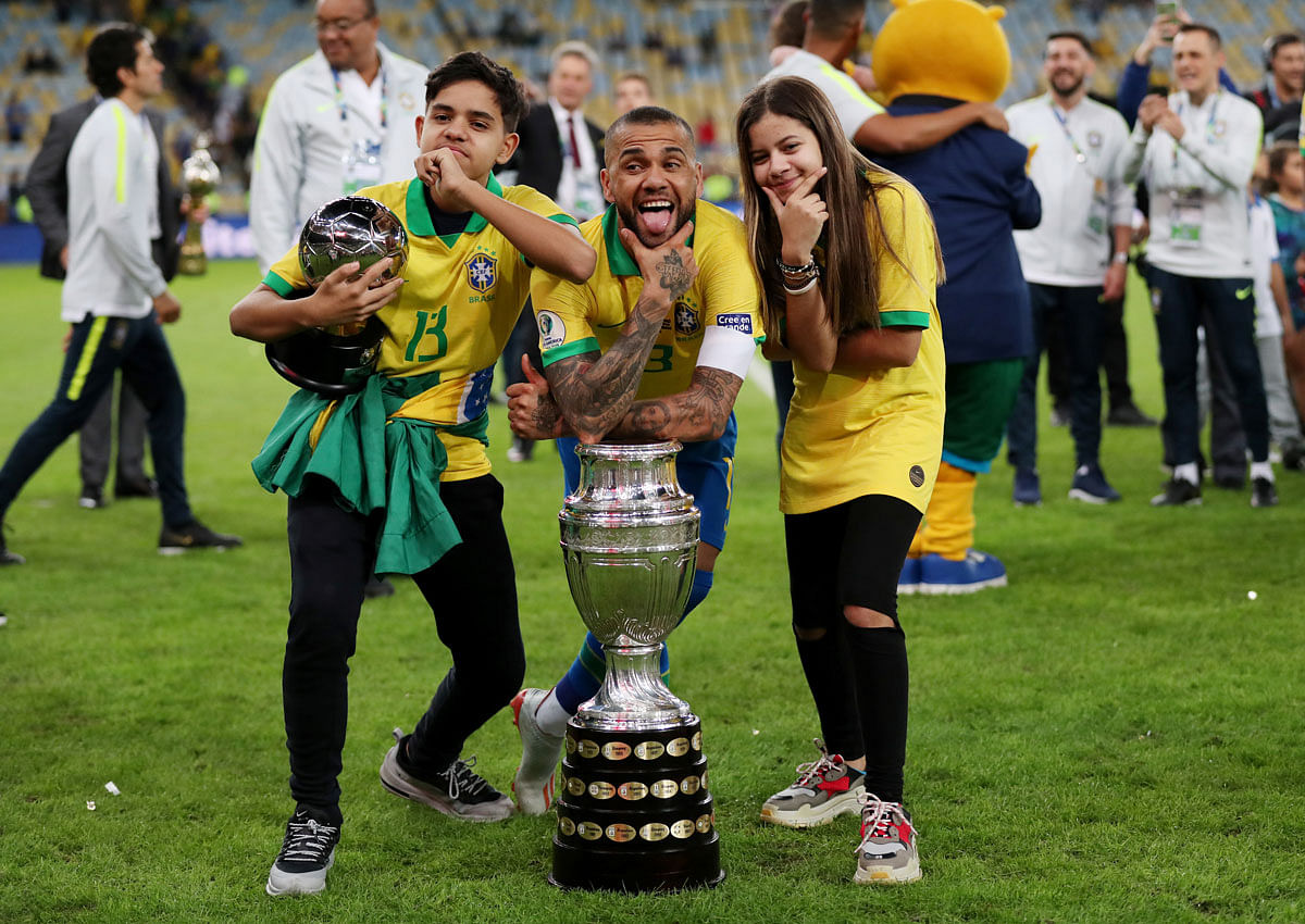 Brazil`s Dani Alves celebrates winning the Copa America with the trophy at Maracana Stadium, Rio de Janeiro, Brazil on 7 July, 2019. Photo: Reuters