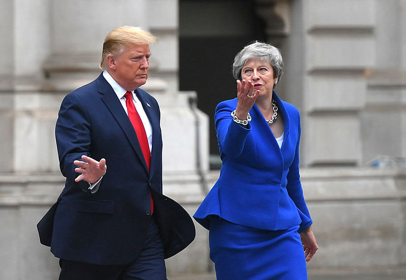 In this file photo taken on 4 June 2019 Britain`s prime minister Theresa May and US president Donald Trump make their way to the Foreign and Commonwealth office for a press conference in London, on the second day of their three-day State Visit to the UK. Photo: AFP